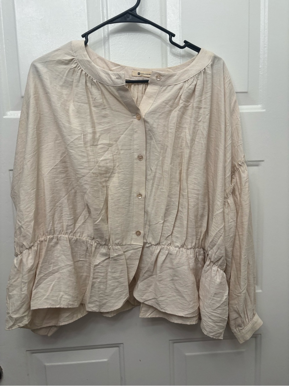 Relaxed Cream Peplum Button-Front Blouse